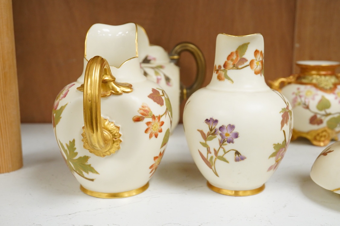 Three Royal Worcester blush ivory jugs, shape 1094, a pair of similar vases and two other Royal Worcester items, the jugs 14cm (7)
